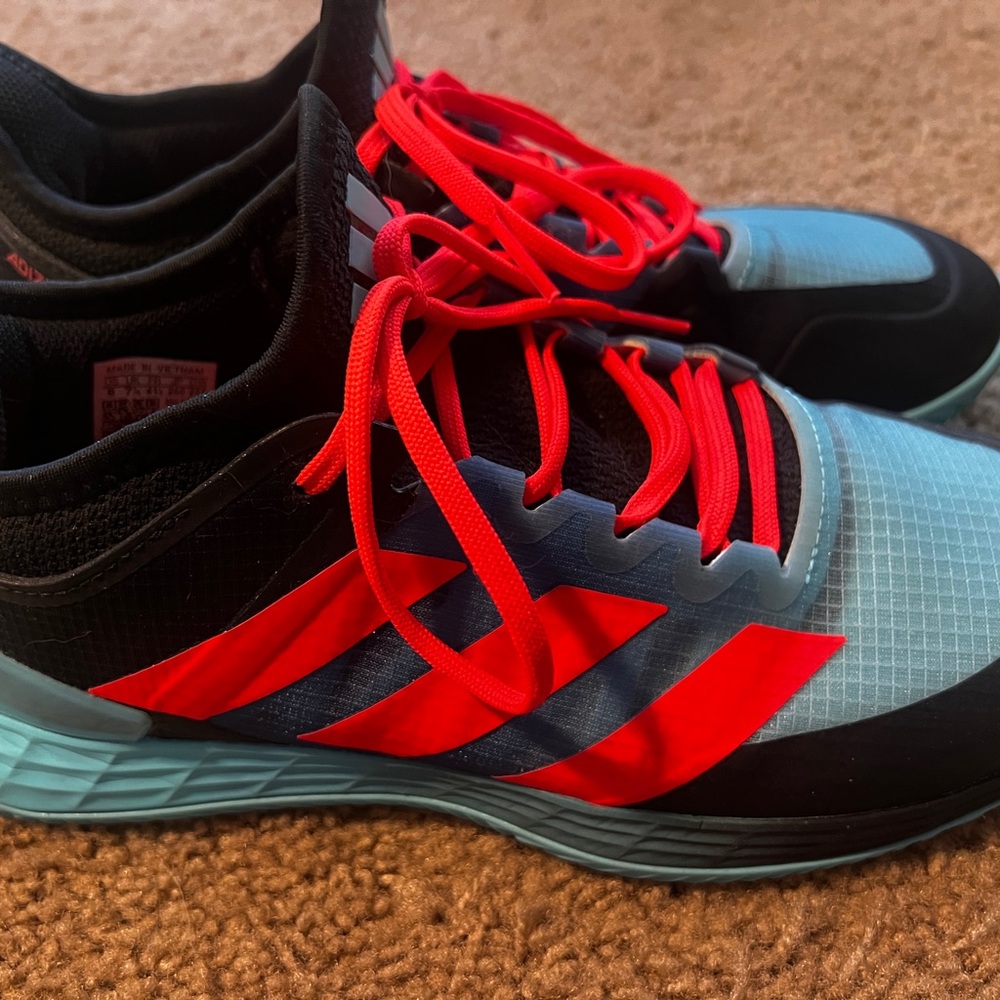 Adidas Adizero Ubersonic sneakers.